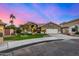 Inviting single-story home featuring a tile roof, desert landscaping, and a two-car garage at 21 W Pecan Pl, Tempe, AZ 85284