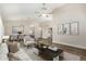 Comfortable living room featuring wood floors, an open floor plan, and neutral decor at 21 W Pecan Pl, Tempe, AZ 85284