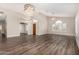 Bright and airy living room with soaring ceilings, modern light fixtures and beautiful wood flooring at 21 W Pecan Pl, Tempe, AZ 85284