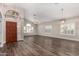 Bright and airy living room with soaring ceilings, modern light fixtures and beautiful wood flooring at 21 W Pecan Pl, Tempe, AZ 85284