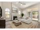 Cozy living room features a fireplace, arched windows, and sliding doors, perfect for relaxation and entertaining at 21 W Pecan Pl, Tempe, AZ 85284