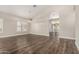 Bright and airy living room with soaring ceilings, modern light fixtures and beautiful wood flooring at 21 W Pecan Pl, Tempe, AZ 85284