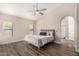 Spacious main bedroom with a ceiling fan, two windows and attached bathroom at 21 W Pecan Pl, Tempe, AZ 85284