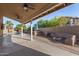 Outdoor living space includes a built-in kitchen, seating area, and sparkling pool for luxurious outdoor living at 21 W Pecan Pl, Tempe, AZ 85284