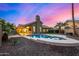 A sparkling pool surrounded by desert landscaping, ideal for relaxation and enjoying outdoor living at 21 W Pecan Pl, Tempe, AZ 85284