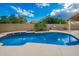 Backyard pool with built in grill and bar great for entertaining with easy access to the yard and seating at 21 W Pecan Pl, Tempe, AZ 85284