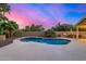 A stunning pool with blue tile accents and a built-in grill, ready for summer fun and poolside barbecues at 21 W Pecan Pl, Tempe, AZ 85284