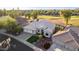 Expansive aerial view of home highlighting a golf course setting and tranquil neighborhood at 22054 N 64Th Ave, Glendale, AZ 85310