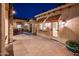 Extended patio area with brick pavers provides an inviting space with seating and outside access to the home and community at 23116 N Del Monte Dr, Sun City West, AZ 85375