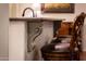 Kitchen island with carved corbels and bar seating at 23116 N Del Monte Dr, Sun City West, AZ 85375