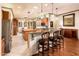 Modern kitchen with granite countertops, stainless steel appliances, a kitchen island with barstool seating at 23116 N Del Monte Dr, Sun City West, AZ 85375