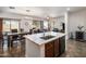 Bright and airy open concept living space with dining area, and kitchen island at 2524 E Katrina Trl, Casa Grande, AZ 85194