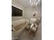 Relaxing bathroom with a soaking tub, vanity, and chandelier for a touch of elegance at 2634 E Fountain St, Mesa, AZ 85213
