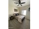 Comfortable bedroom with a bed, stylish side table, modern decor, and ceiling fan at 2634 E Fountain St, Mesa, AZ 85213