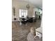 Inviting dining area showcases a modern chandelier, dining table with chairs, and access to the kitchen at 2634 E Fountain St, Mesa, AZ 85213
