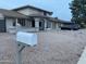 Suburban home with low-maintenance gravel yard and welcoming covered porch, providing curb appeal at 2634 E Fountain St, Mesa, AZ 85213