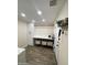 Laundry room with a folding counter, utility sink, storage, and convenient hanging rod at 2634 E Fountain St, Mesa, AZ 85213