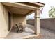 Inviting covered patio with comfortable seating, string lights, and view of the gravel backyard at 2753 S 85Th Way, Mesa, AZ 85209