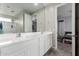 Bathroom with double sink vanity, large mirror and shower-tub combination and bedroom view at 2753 S 85Th Way, Mesa, AZ 85209