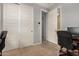 Bedroom with carpet, white paneled doors, and workspace visible at 2753 S 85Th Way, Mesa, AZ 85209