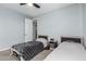 Bright bedroom featuring two twin beds, ceiling fan and a calming color scheme at 2753 S 85Th Way, Mesa, AZ 85209