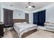 Bedroom with ceiling fan, neutral carpet and blue accent walls at 2753 S 85Th Way, Mesa, AZ 85209