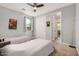 Bedroom with gray walls, ceiling fan, carpet floors, window and closet at 2753 S 85Th Way, Mesa, AZ 85209