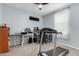 Bedroom featuring a treadmill, ceiling fan, and a desk area with natural lighting at 2753 S 85Th Way, Mesa, AZ 85209