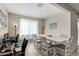 Dining area featuring a white table, chairs, and natural light at 2753 S 85Th Way, Mesa, AZ 85209