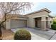 Inviting home featuring a two-car garage and a charming, well-maintained yard at 2753 S 85Th Way, Mesa, AZ 85209