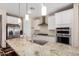 Modern kitchen with granite countertops, stainless steel appliances, and white cabinets at 2753 S 85Th Way, Mesa, AZ 85209