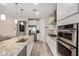 Well-lit kitchen with stainless steel appliances, granite countertops, and tile floors at 2753 S 85Th Way, Mesa, AZ 85209