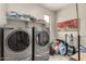 Laundry room area features modern appliances and shelving at 2753 S 85Th Way, Mesa, AZ 85209