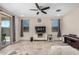 Bright living room featuring tile flooring, comfortable seating, and outdoor access at 2753 S 85Th Way, Mesa, AZ 85209