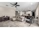Open-concept living room with tile flooring, neutral colors, and a ceiling fan at 2753 S 85Th Way, Mesa, AZ 85209