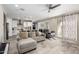 Bright living room featuring tile flooring, neutral tones, and an open flow to the kitchen at 2753 S 85Th Way, Mesa, AZ 85209