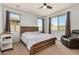 Cozy main bedroom with plush carpet, neutral paint, ceiling fan, and backyard views at 2753 S 85Th Way, Mesa, AZ 85209