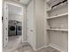 Mud room area includes built-in shelving with access to the laundry room at 2753 S 85Th Way, Mesa, AZ 85209