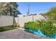 This backyard features a garden area with mature green landscaping on a tiled patio at 2910 E Avenida Olivos --, Phoenix, AZ 85016