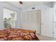Cozy bedroom featuring natural light from the window and a closet with louvered doors at 2910 E Avenida Olivos --, Phoenix, AZ 85016
