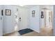 Inviting entryway with tiled flooring, white door, and decorative wall art at 2910 E Avenida Olivos --, Phoenix, AZ 85016