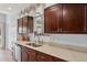 Well-maintained kitchen featuring dark wood cabinetry and a bright, clean countertop space at 2910 E Avenida Olivos --, Phoenix, AZ 85016