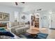 Open-concept living room boasts abundant natural light and a seamless flow to the adjacent dining and kitchen areas at 2910 E Avenida Olivos --, Phoenix, AZ 85016