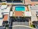 Aerial view of a private backyard oasis with a sparkling pool, lush landscaping, and parking space at 2910 E Avenida Olivos --, Phoenix, AZ 85016