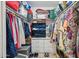 Large walk-in closet with custom shelving and ample storage space for clothing and accessories at 2910 E Avenida Olivos --, Phoenix, AZ 85016