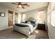 Serene main bedroom featuring a luxurious bed, neutral tones, and access to a private balcony at 2918 N 48Th Pl, Phoenix, AZ 85018