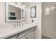 Beautiful bathroom features a vanity with quartz countertop, framed mirror, and decorative tile floor at 3016 N 49Th St, Phoenix, AZ 85018