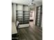 Walk-in closet featuring custom shelving and drawers with view to bedroom at 3016 N 49Th St, Phoenix, AZ 85018