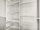 Walk in closet with custom white shelving and metal storage baskets at 3016 N 49Th St, Phoenix, AZ 85018