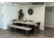Elegant dining room featuring a sleek concrete table with bench and chairs at 3016 N 49Th St, Phoenix, AZ 85018